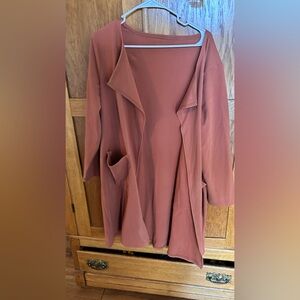 Manufacturer unknown. Ordered on Amazon, soft material, flowy cover up grey L